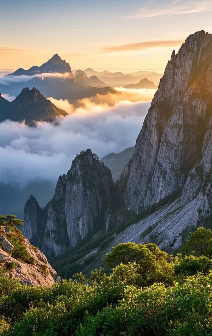 A hiker on a rugged trail in Yangjiajie overlooking unique rock formations